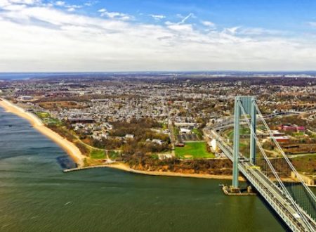 Aerial view on Verrazano-Narrows Bridge over the Narrows. It connects Brooklyn and Staten Island. Narrows is strait connecting Upper Bay with Lower Bay. View on Fort Wadsworth in Staten Island