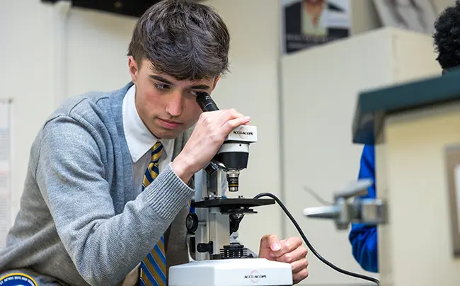 Student using a microscope