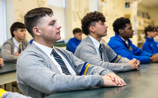 853A4706 boys in a classroom paying attention