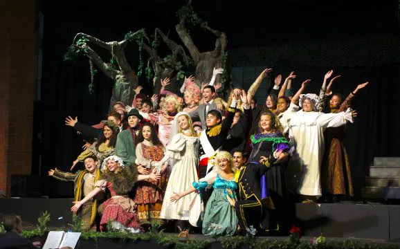 IMG_5210-578x360 a theater group taking a large group picture after a performance.