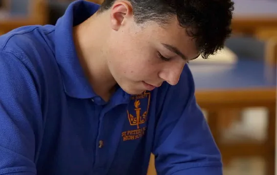 admissions_side_image A student concentrating in class